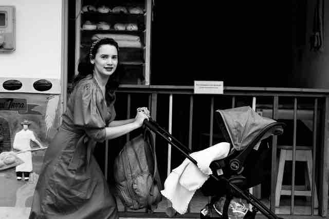 Image mother walks with trolley